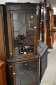 An early 20th Century mahogany corner display , having astral glazed upper and lower sections ,