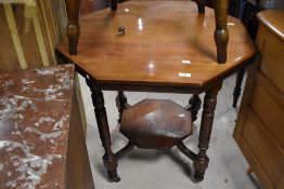 A Victorian mahogany occasional table having octagonal top and undertier, with turned legs, width