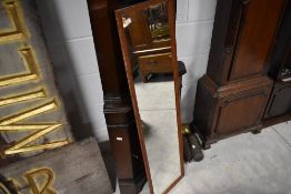 A reproduction corner display, height approx. 180cm, and a full length wall mirror