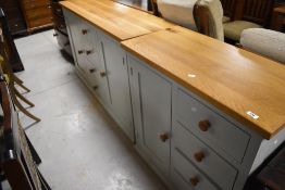 A modern side unit , having golden oak top and painted frame, width approx 89cm, depth 43cm,