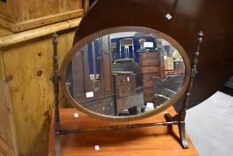 An early 20th Century mahogany toilet mirror, width approx. 64cm
