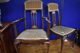 A pair of Art Nouveau mahogany salon or dining chairs (one being a carver chair) having inlaid