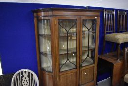 An Edwardian mahogany display cabinet , having inlaid decoration, height approx. 172cm