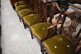 A set of six (four plus two) early 20th Century mahogany framed dining chairs in the Hepplewhite