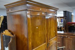 A reproduction yew wood wardrobe, height approx. 191cm, width approx. 130cm