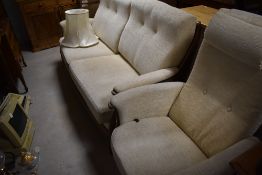A vintage two piece lounge suite, Ercol (Gina range) having wood frame and cream upholstery