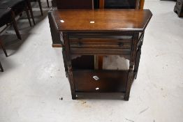 A vintage oak Priory style hall table, width approx. 80cm