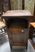 An Arts & Crafts dark oak pot cupboard, height approx. 77cm