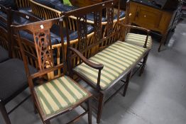 An Edwardian mahogany three piece salon suite , having line Art Nouveau influence with line inlay