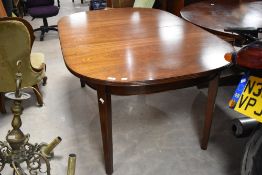 A modern mahogany oval extending dining table, by Bath cabinet makers, approx 105 x 162cm, plus
