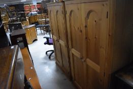 A pair of modern pine wardrobes (feet removed for convenience) each height 149 + 13cm, width 88cm