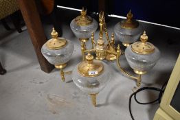 A modern gilt brass ceiling light fitting having five branches , with crackled glass shades
