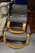 A modern easy chair in the stressless style, with similar footstool
