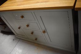 A modern side unit , having golden oak top and painted frame, width approx 150cm, depth 43cm, height