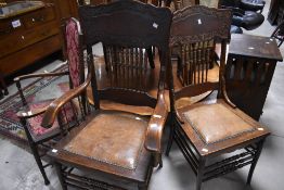 A pair of 19th Century vernacular spindle back chairs having carved decoration and turned frame with