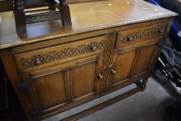 An early to mid 20th Century oak sideboard, possibly Old Charm, width approx. 125cm