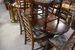 A vintage Priory style dining table and eight (six plus two) chairs