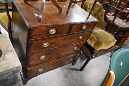 A 19th Century oak chest of two over three drawers having brass handles and bracket feet, width