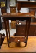 An Edwardian mahogany occasional table having rectangular top with inlaid decoration and shaped