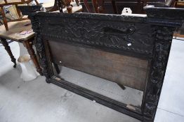 A large period oak frame , probably from over mantel , having mythical figural carved decoration,