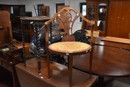 An Edwardian mahogany corner chair