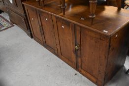 A Victorian stained frame kitchen dresser base unit or similar having two double cupboards ,
