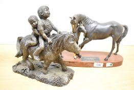 A late-20th century Beswick model of 'Black Beauty & Foal', having an oval wooden base, sold