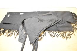 Two pieces of Victorian / Edwardian mourning wear, to include a silk half-apron with pointed hem,