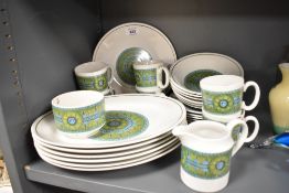 A 1970's ceramic part dinner/tea service having a distinctive green, brown and blue geometric