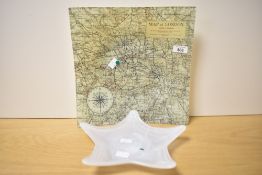 A vintage Map of London printed to large glass plate measuring 29cm x 29cm sold together with an