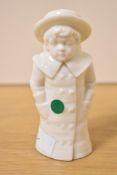 A Royal Worcester fine bone china figurral pepperette depicting a young boy in coat and hat,