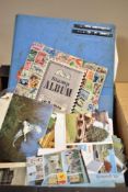 Two part filled stamp albums sold along with a small selection of loose stamps and a collection of