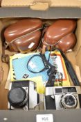 Two 35mm cameras, an Agfa Optima I and an Exakta Exa Iia, both with leather cases and straps and