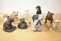 A group of nine amateur dog studies to include a large Coopercraft pottery Bulldog etc.