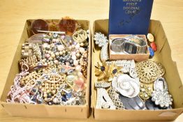 An assortment of costume jewellery, including faux pearls, beaded jewellery, brooches and watch