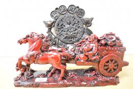 Two modern Chinese Decorative arts resin ornaments, featuring a large red resin statue of horses