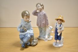 Two Nao by Lladro porcelain figures 'Boy with Bear' and 'Boy with Bunny' sold alongside the Royal