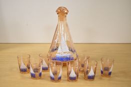A 20th-century French Studio Glass decanter with eight shot glasses, of a peach-glass colouration