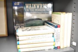 A collection of Wainwright books including ten of the small hand books and two large colour tites.