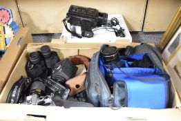 A Yashika FX-D quartz camera with 35-105mm zoom lens, a Minolta 7000 F camera with 35-70mm zoom