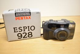 Pentax Espio 928, compact 35mm point-and-shoot film camera with a 28–90mm zoom lens.