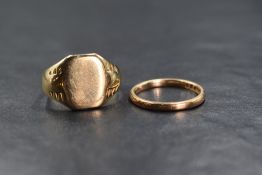 A gent's yellow metal signet ring of worn form stamped 9ct and a small 9ct rose gold wedding band,