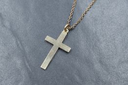 A 14ct gold cross pendant of plain form on an 18' 9ct gold chain, approx 5.5g gross
