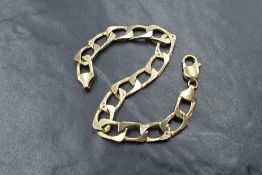 A 9ct gold diamond set curb link bracelet, four of the wide curb links set with diamond chips to the