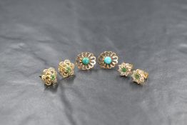 Two pairs of 9ct gold earrings having emerald and turquoise decoration and a pair of yellow metal