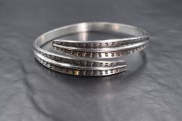 A Norwegian silver torque bangle by David Anderson having quill style shaped terminals, approx 37g
