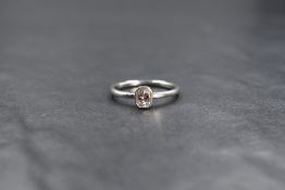 A platinum Pheonix cut diamond solitaire ring, the radiant shaped pheonix cut diamond being approx