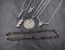 A selection of silver pendants including moonstone, amethyst and aqua marine style, and a silver