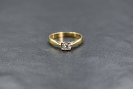 An 18ct gold diamond set solitaire ring, the princess cut diamond measuring approximately 0.24ct, in