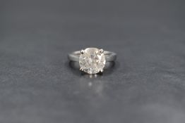 An 18ct white gold diamond set solitaire ring, the round brilliant cut diamond measuring 3.07ct in a